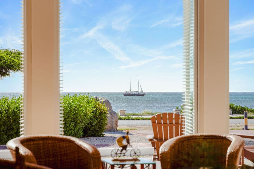 Wake up to this view—morning coffee, ocean breeze, and a sailboat drifting by. A quiet spot to slow down and just enjoy the moment.