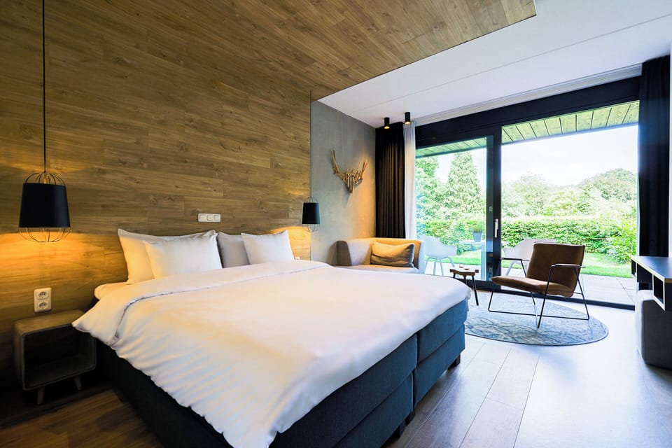 Deluxe Double Room, Patio, Garden View | In-room safe, desk, laptop workspace, blackout drapes