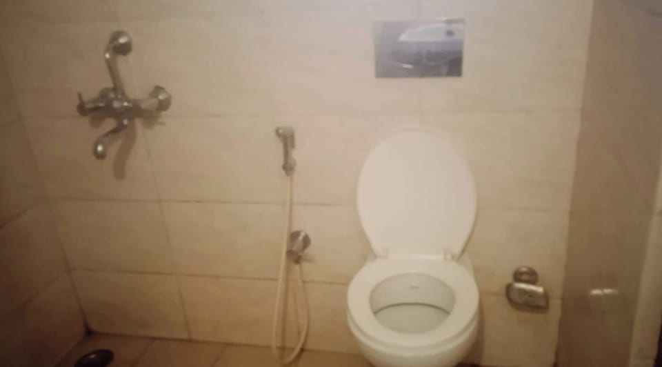 Shower, rainfall showerhead, slippers, towels