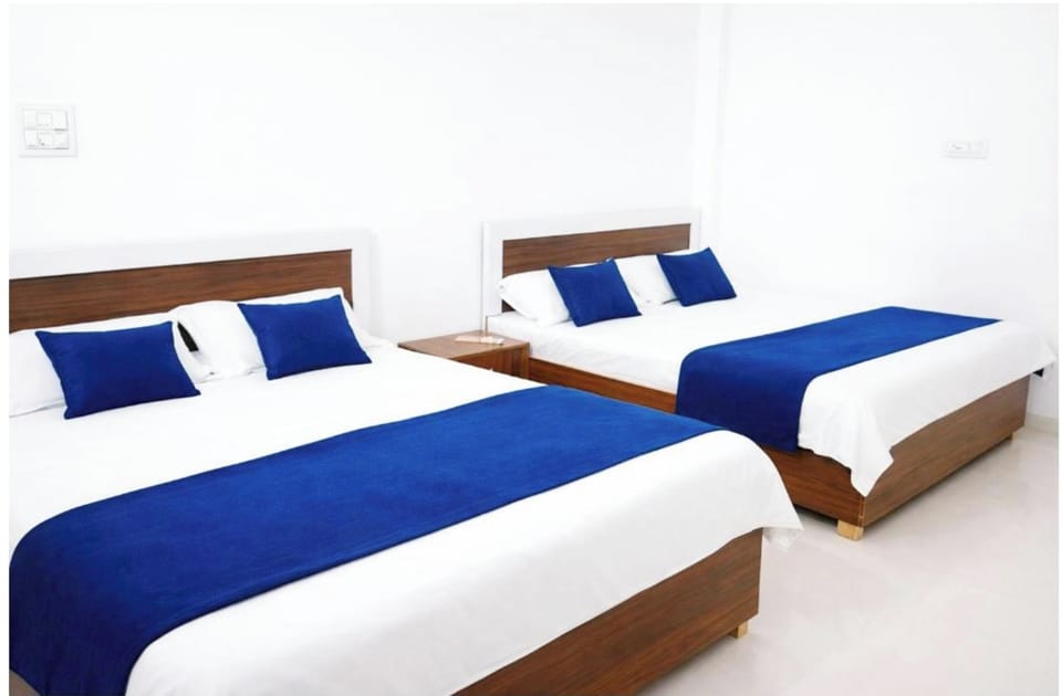 Deluxe Quadruple Room, Air conditioning | Hypo-allergenic bedding, desk, soundproofing, free WiFi