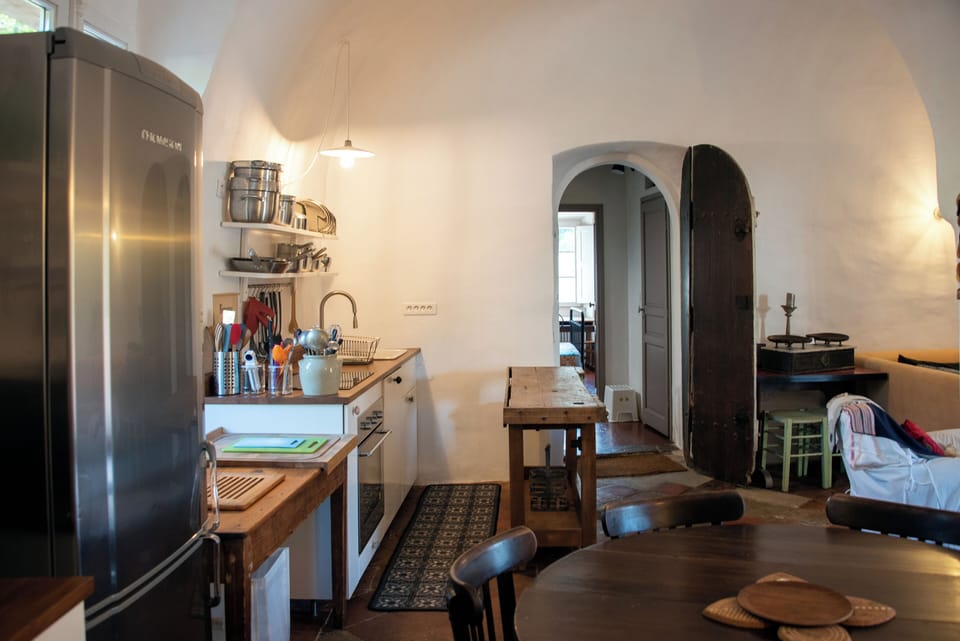 Authentic terracotta floors and rustic wooden island for cooking together.