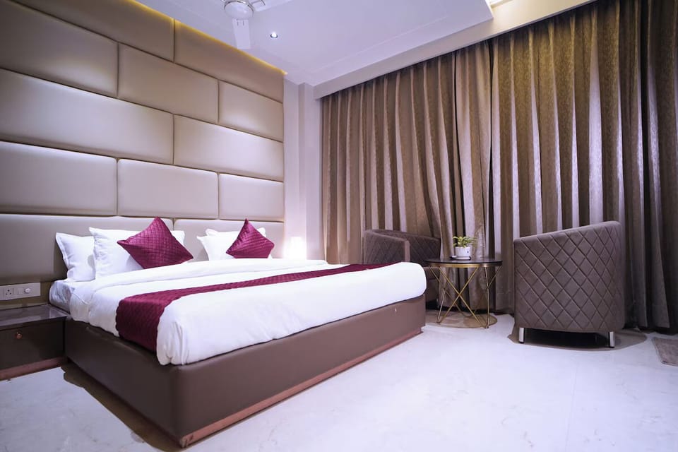 Executive Room, City View | Desk, laptop workspace, blackout drapes, iron/ironing board