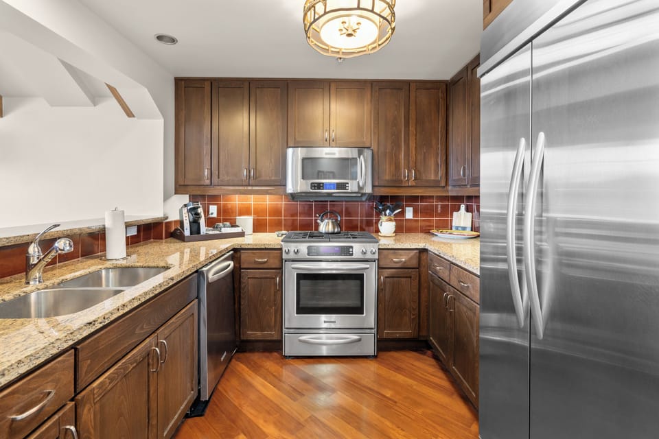 Fully equipped with high-end appliances, a Keurig Coffee machine, wine and champagne glasses, and every tool imaginable for cooking and entertaining.