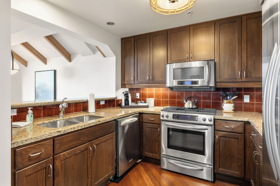 Fully equipped with high-end appliances, a Keurig Coffee machine, wine and champagne glasses, and every tool imaginable for cooking and entertaining.