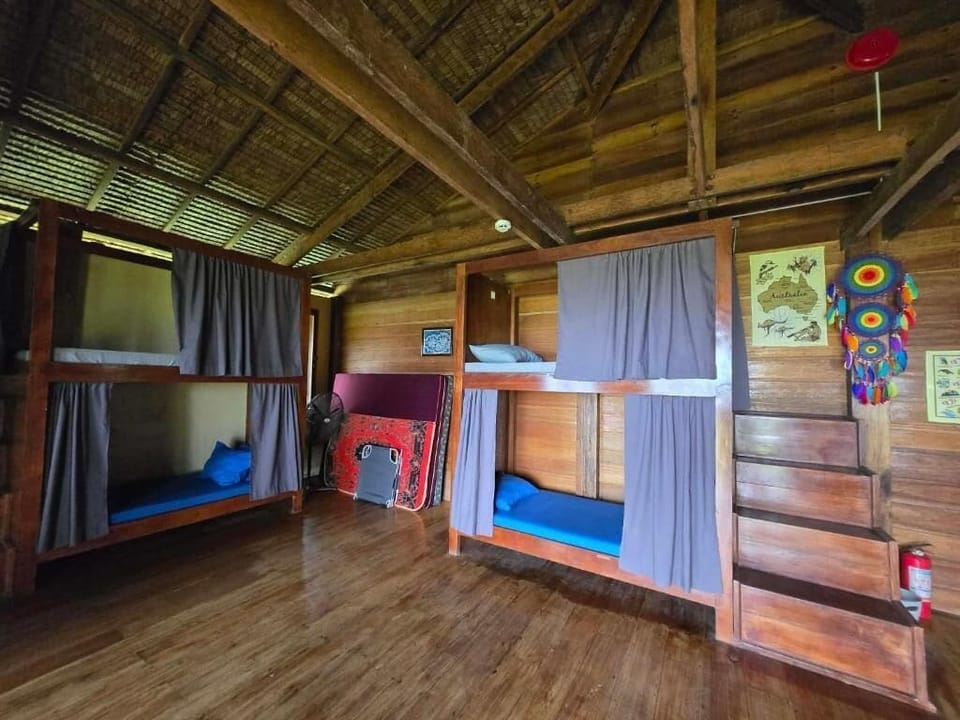 Family Shared Dormitory, Patio, Beach View | Individually decorated, individually furnished, desk