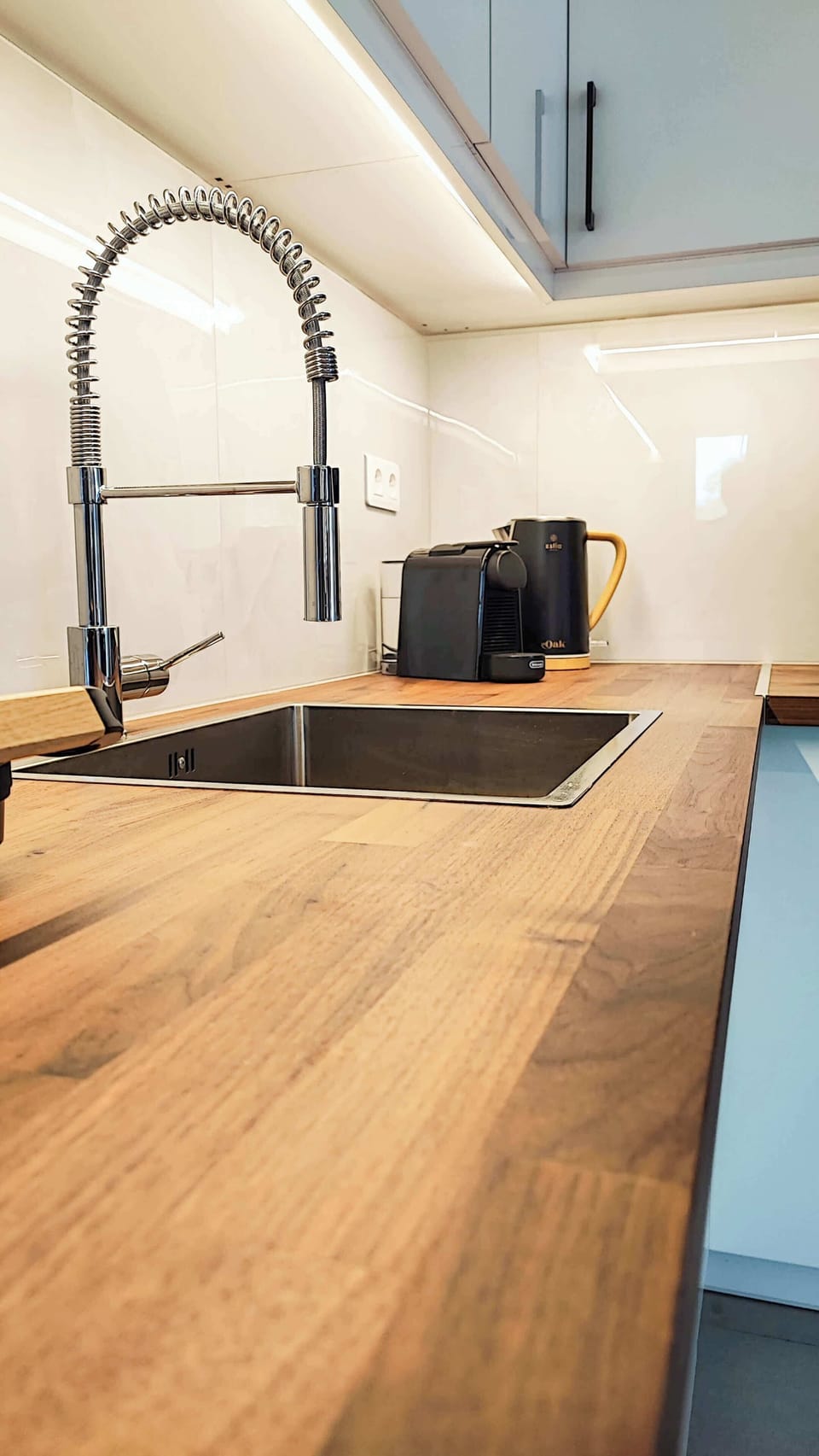Wooden countertops and modern fixtures provide plenty of preparation space. Perfect for cooking with fresh local ingredients from nearby markets