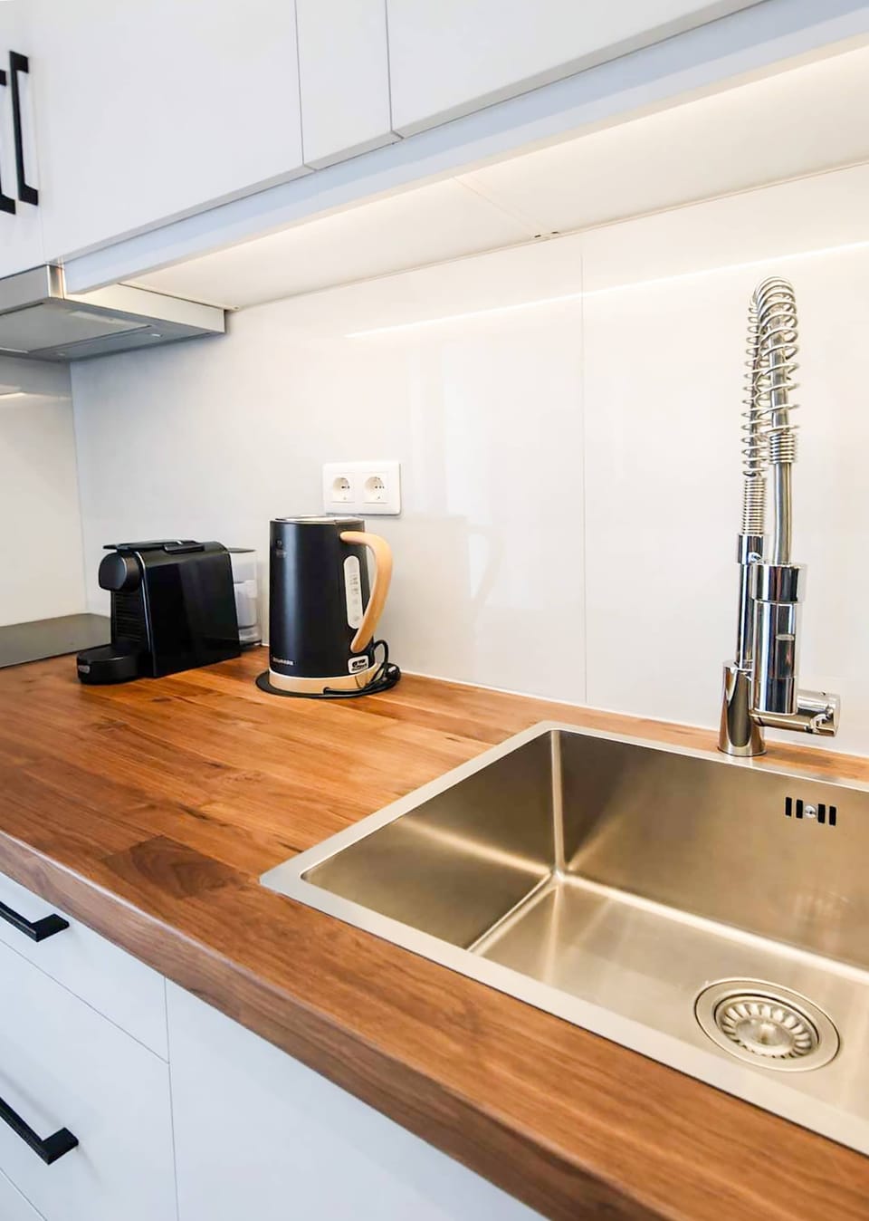 Wooden countertops and modern fixtures provide plenty of preparation space. Perfect for cooking with fresh local ingredients from nearby markets