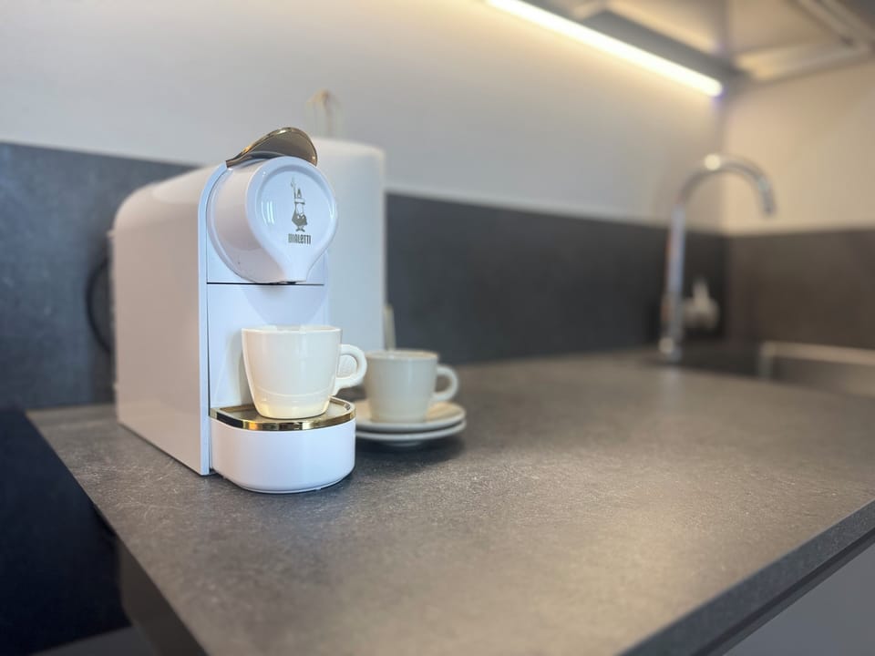 Deluxe Studio, Private Bathroom, City View | Coffee and/or coffee maker