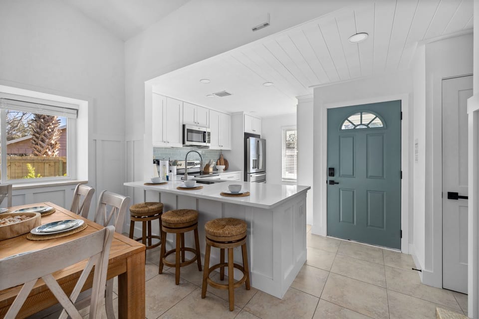 A chef-ready kitchen with stainless steel appliances, spacious prep areas, and fresh coastal finishes — perfect for family breakfasts or post-beach dinners 🌊
