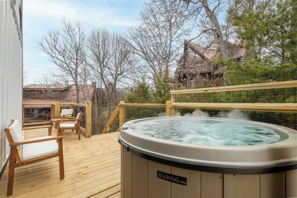 Soak away your stress in this bubbling hot tub while enjoying peaceful neighborhood views from your private deck.