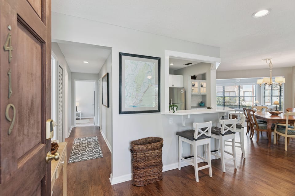 Step into your open-concept haven where the kitchen flows seamlessly into dining and living spaces, creating the perfect backdrop for memorable meals together.