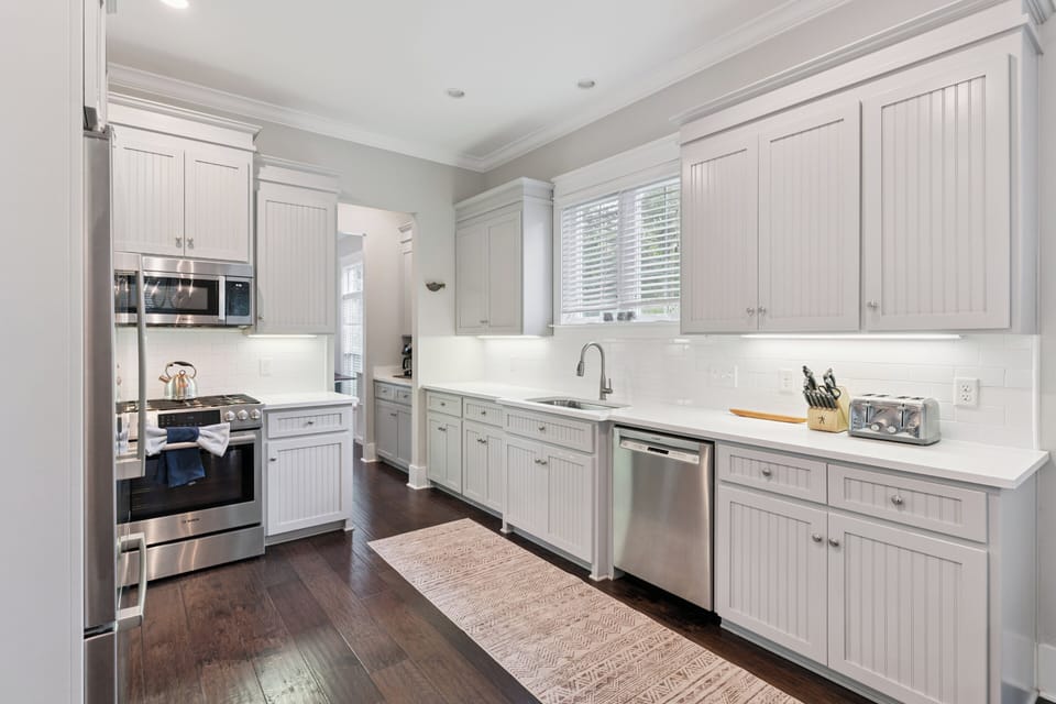 Cook up your favorite meals in this bright, well-equipped kitchen featuring stainless steel appliances, ample counter space, and custom cabinetry that blends style with function.