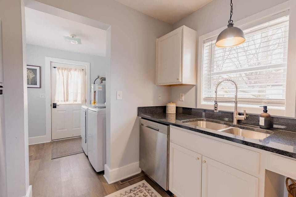 Kitchen looking onto laundry room and back door
