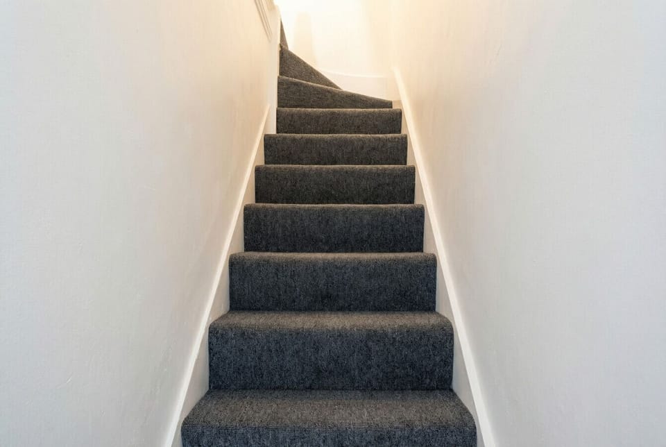 Private carpeted staircase leads up to your own front door.