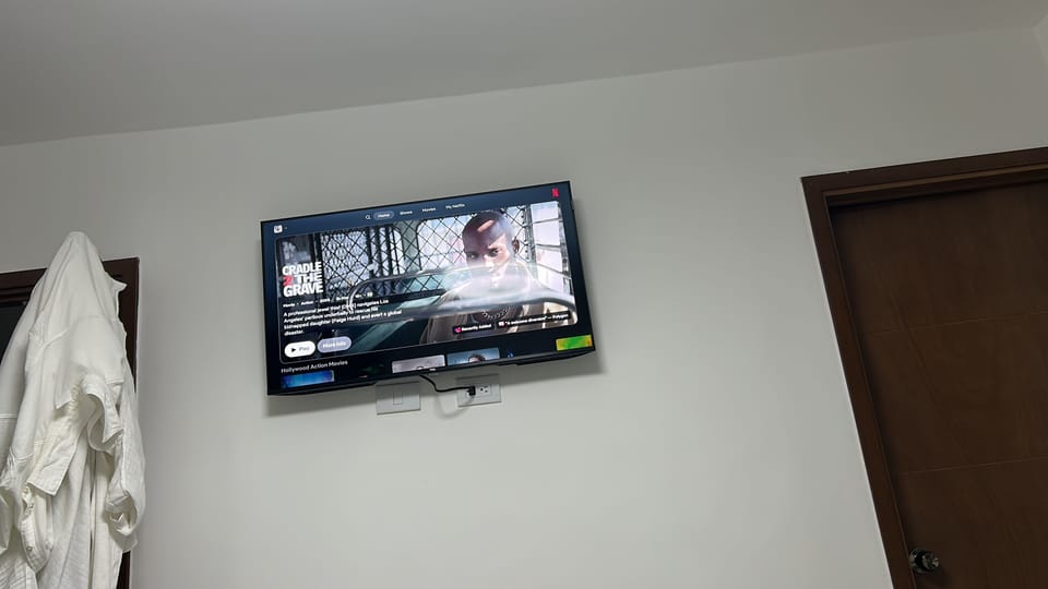 Living /dining room with big flat screen tv