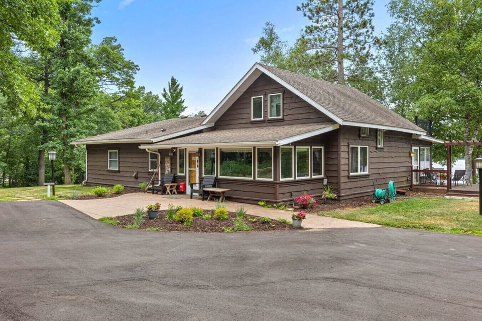 Front Exterior | Spacious Driveway | Lush Surroundings