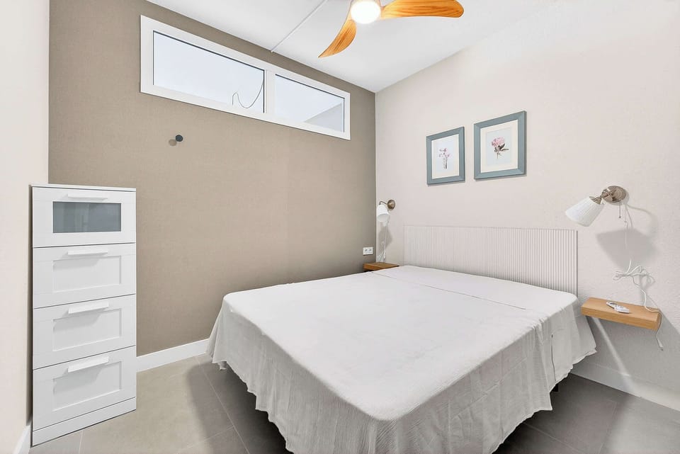 Bright Minimalist Bedroom with Comfortable Double Bed & Soft Lighting