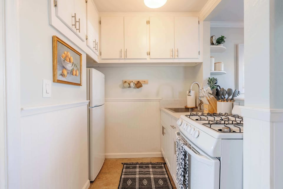 Fully equipped kitchen with full-size appliances and everything needed for home-cooked meals.