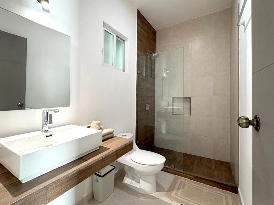 Classic Double Room, 2 Queen Beds | Bathroom | Shower, hair dryer (on request), towels, soap