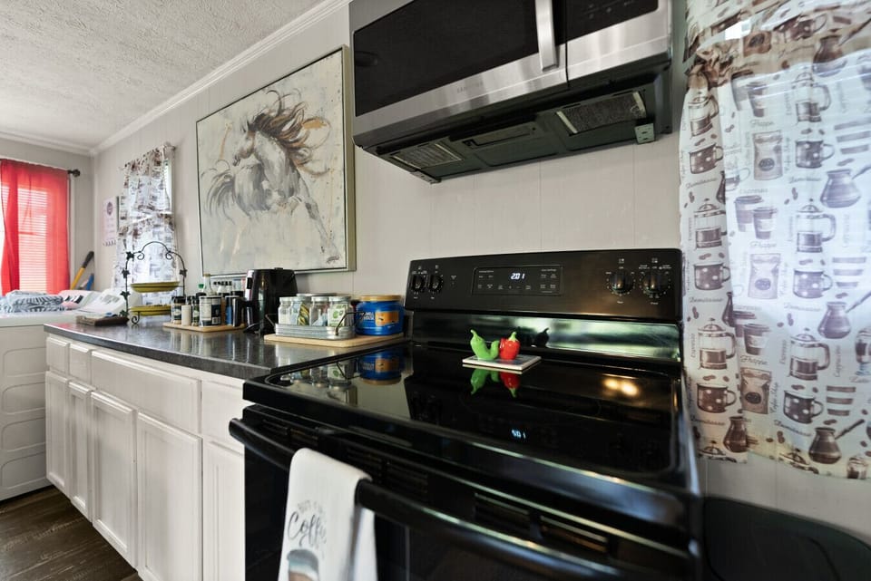 Kitchen | Electric Range | Stainless Microwave | Coffee Station