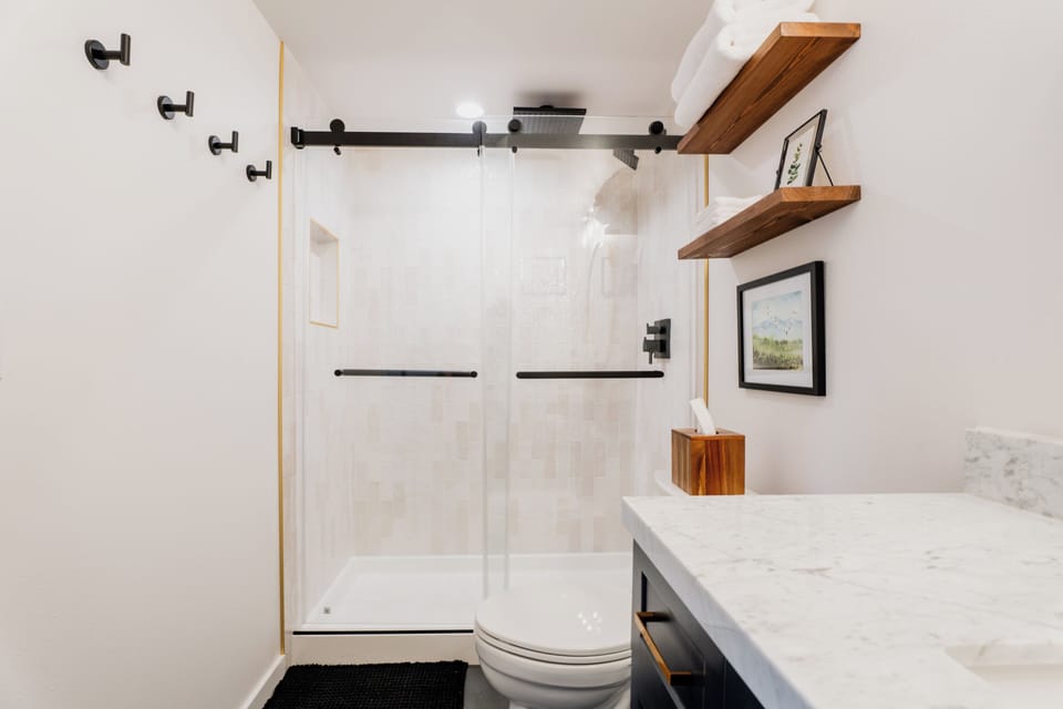 Rain shower, heated tile floors, marble counters