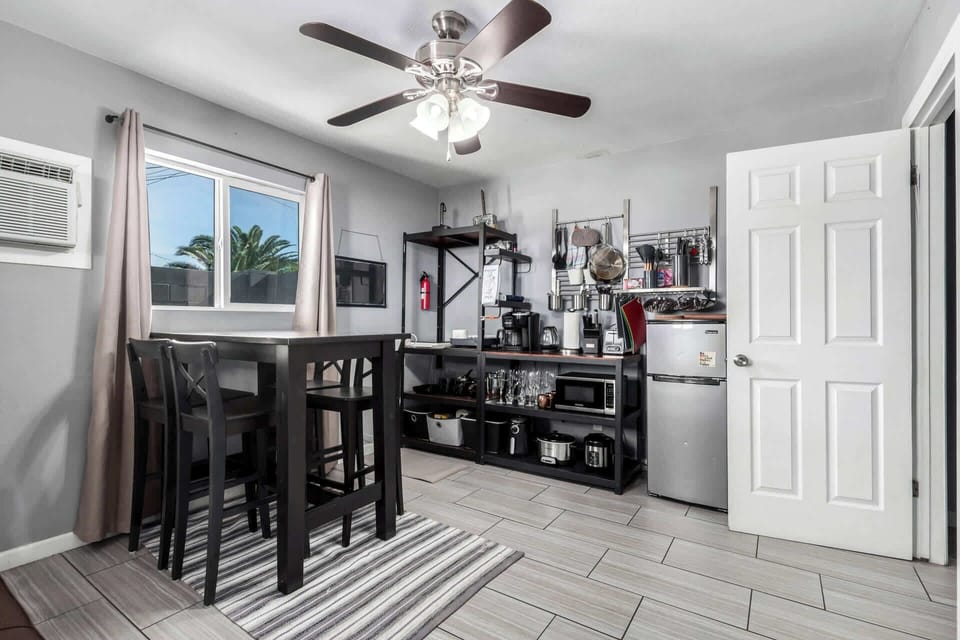 Compact kitchenette with induction cooktop and essentials.
