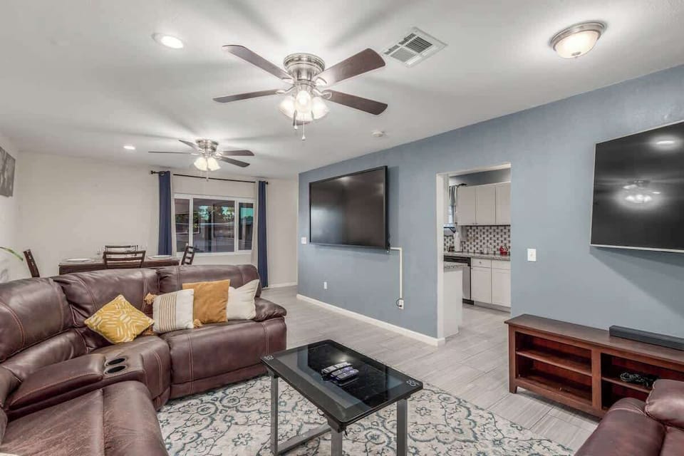 Bright open living area with large TV