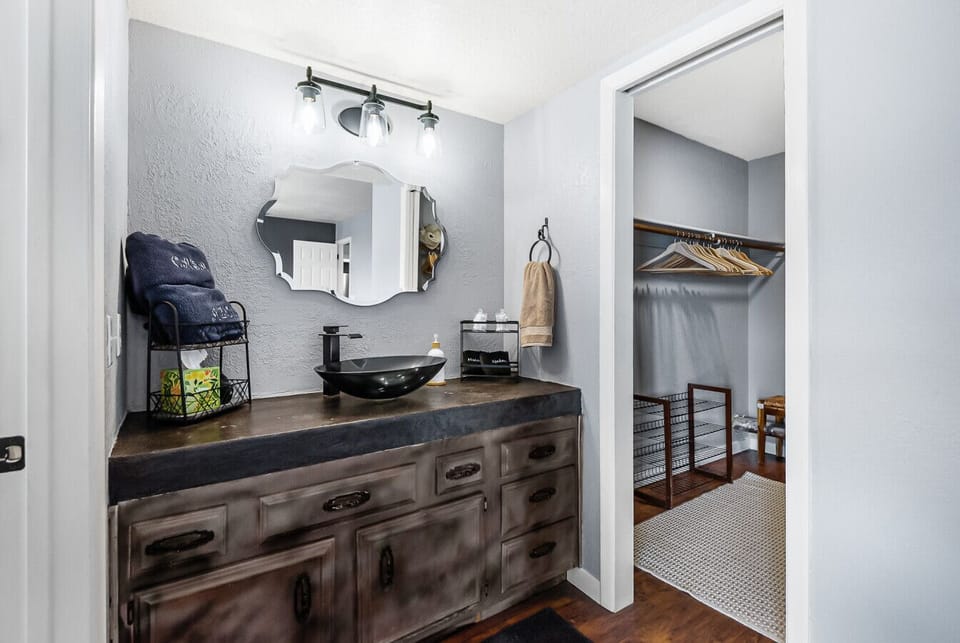 Washroom corner : Sleek modern sink and spacious countertop. A clean, contemporary space to prepare for your day.