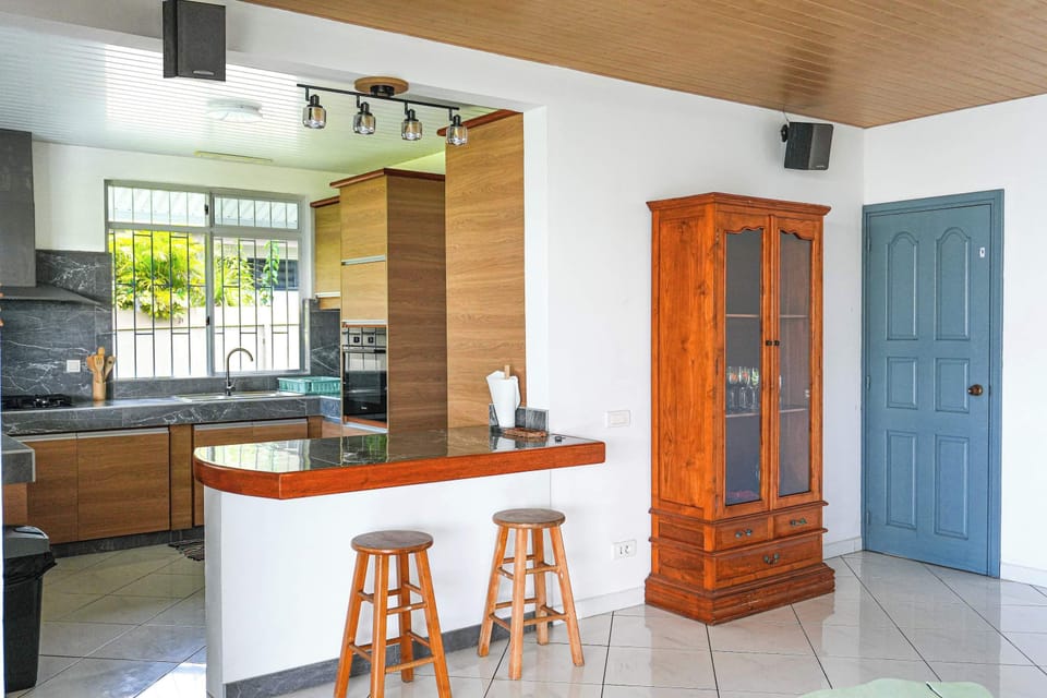 Open kitchen with clean countertops and everything needed for cooking comfortably.
