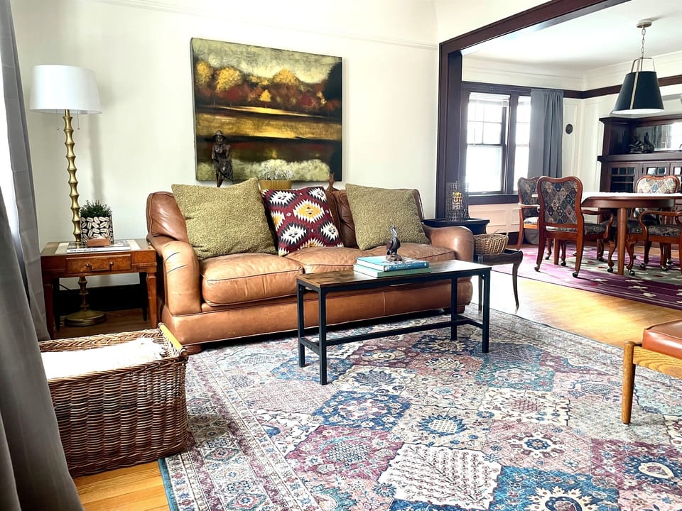 A cozy living space designed for relaxing evenings, with comfortable seating and classic Craftsman charm.