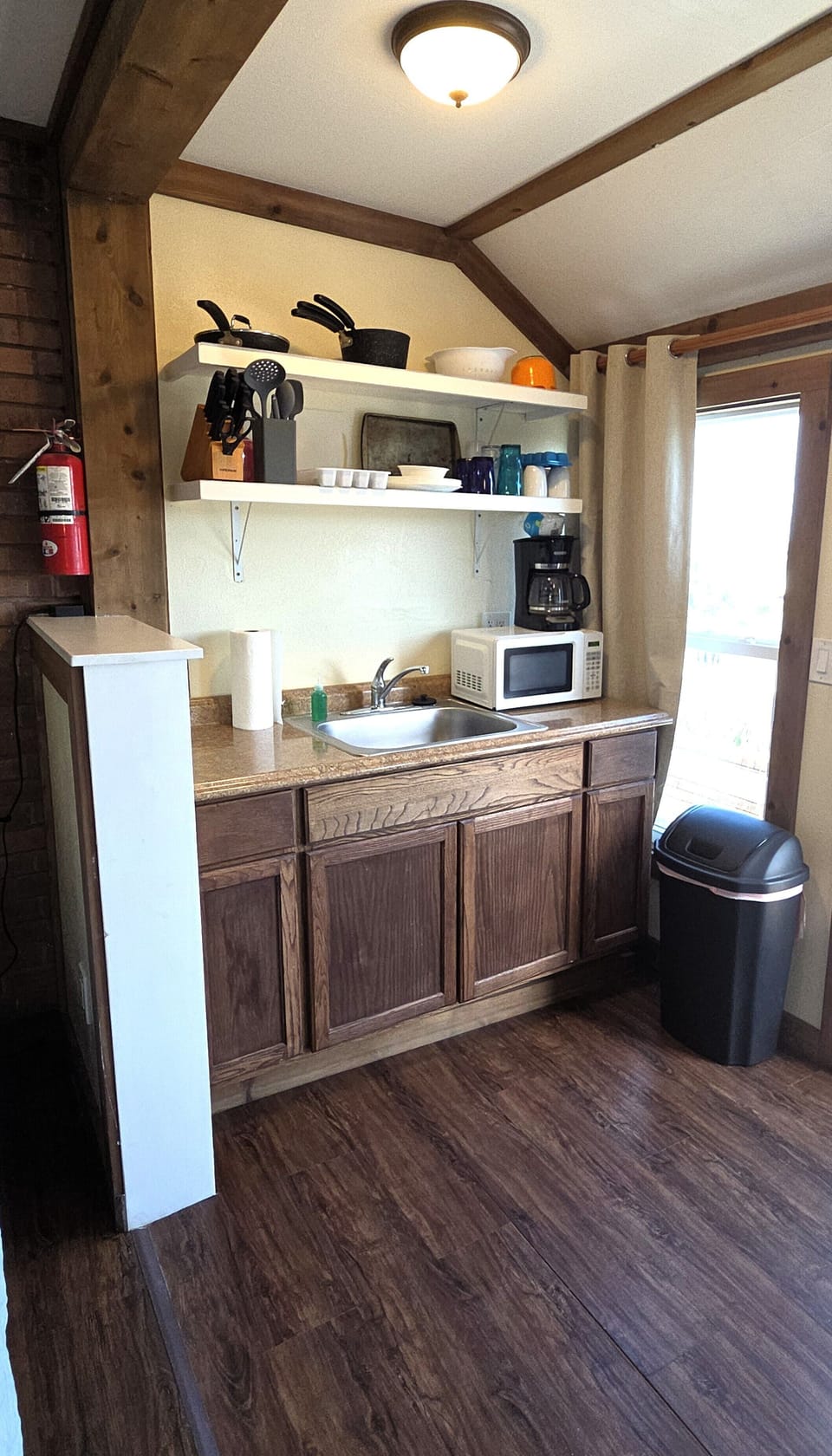 The full kitchen has cooking basics, a microwave, and a drip coffee maker