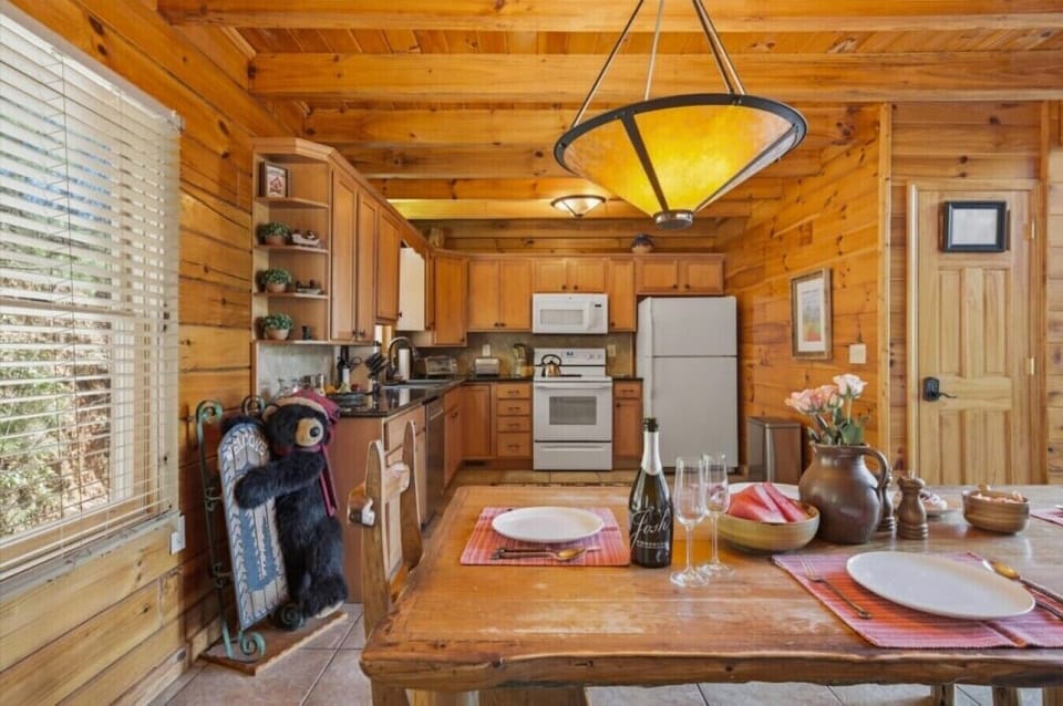 Dining Area | Wood Table & Pendant Light | Open Kitchen View