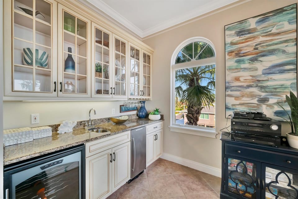Wet bar with beverage fridge and storage