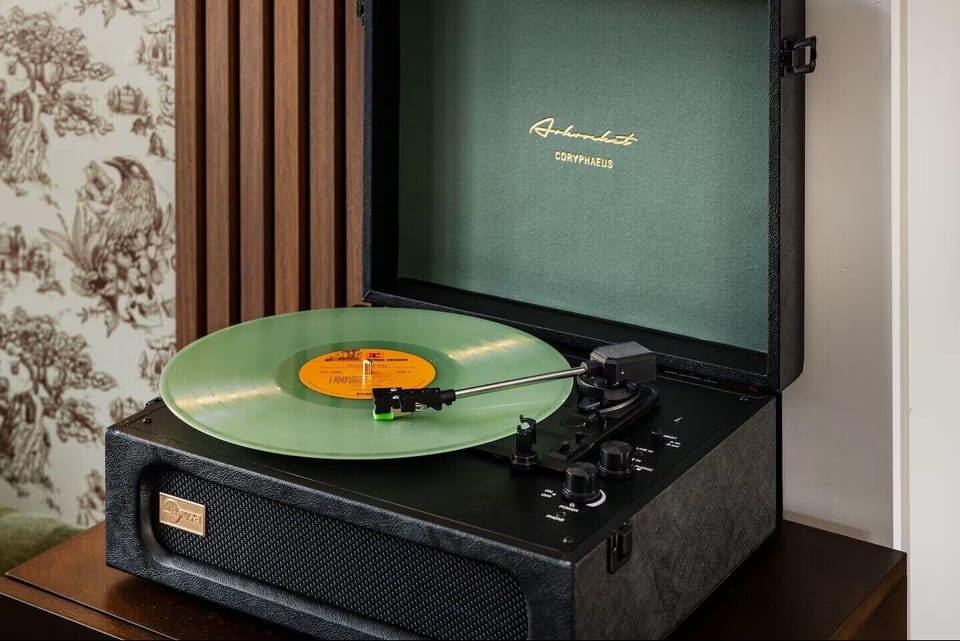 Enjoy the provided records or Bluetooth your own device.