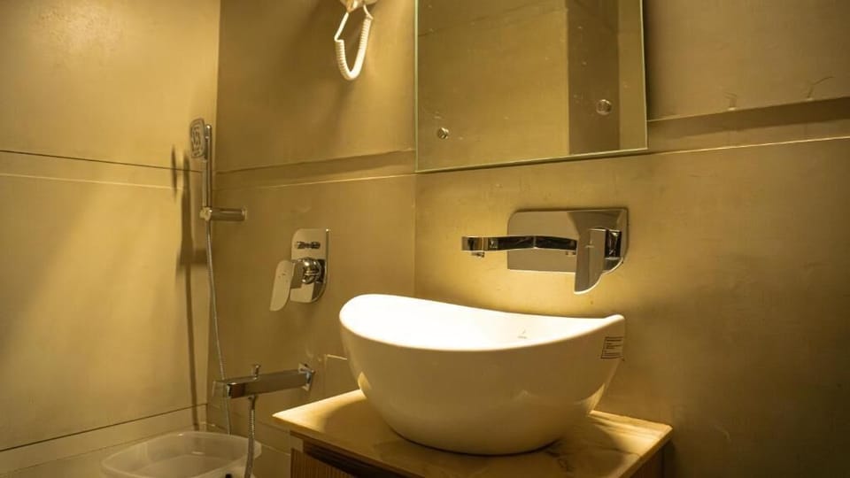 Shower, hair dryer, slippers, towels