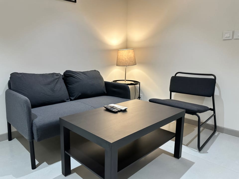 Luxury Double Room | Living area | 50-inch LED TV with satellite channels