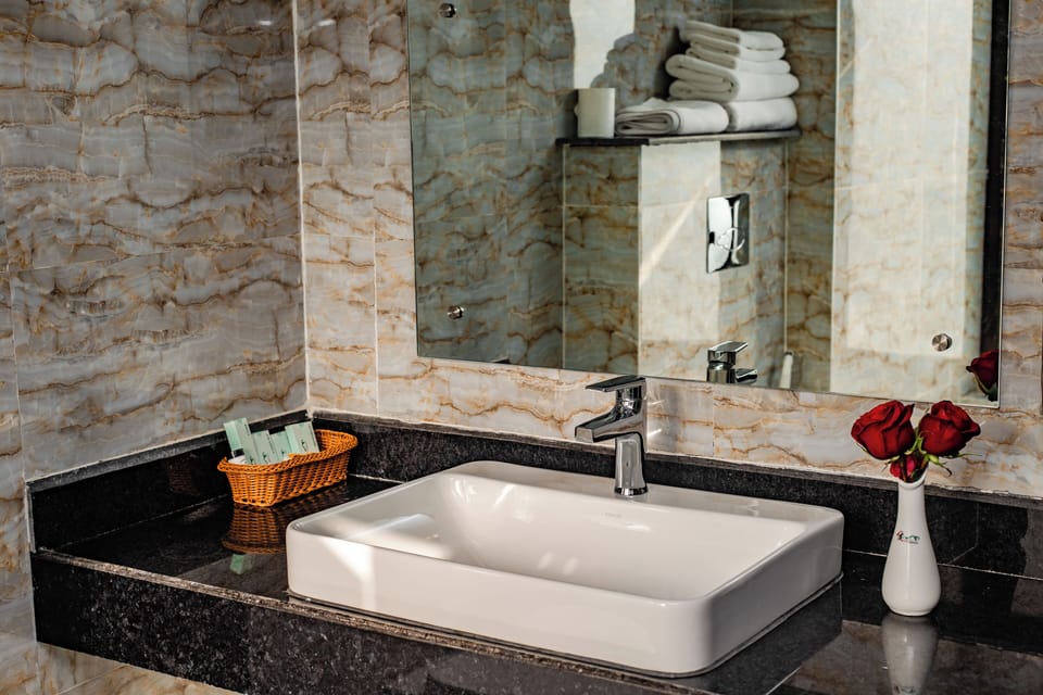 Suite, Balcony | Bathroom | Shower, free toiletries, hair dryer, slippers
