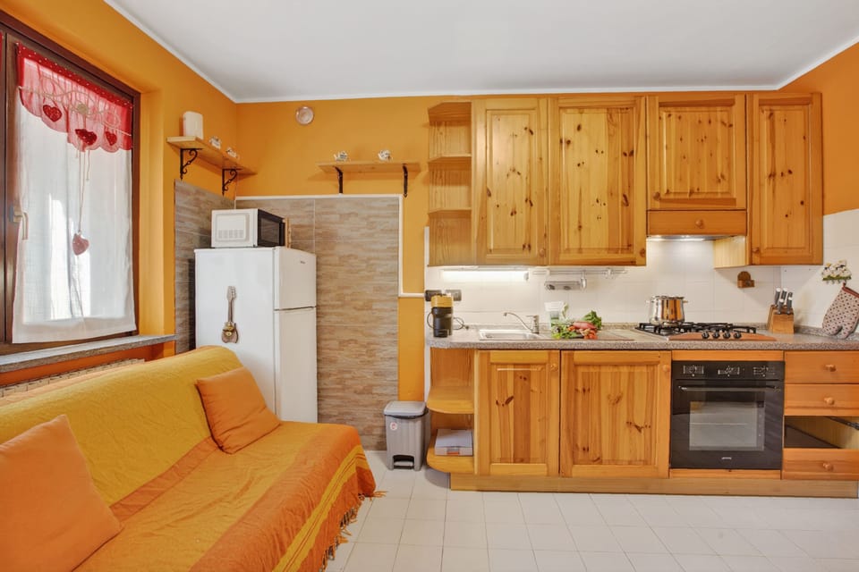 Standard Apartment, Multiple Bedrooms (Station Inn Oulx) | Private kitchen | Fridge, microwave, oven, stovetop