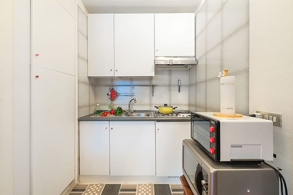 Standard Apartment, Multiple Bedrooms (Appartamento Cuore Alpino) | Private kitchen | Fridge, microwave, stovetop, toaster