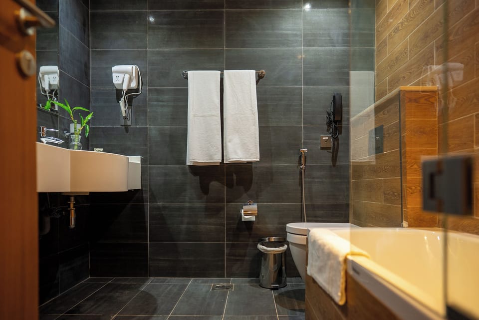 Superior Room | Bathroom | Rainfall showerhead, eco-friendly toiletries, hair dryer, bathrobes
