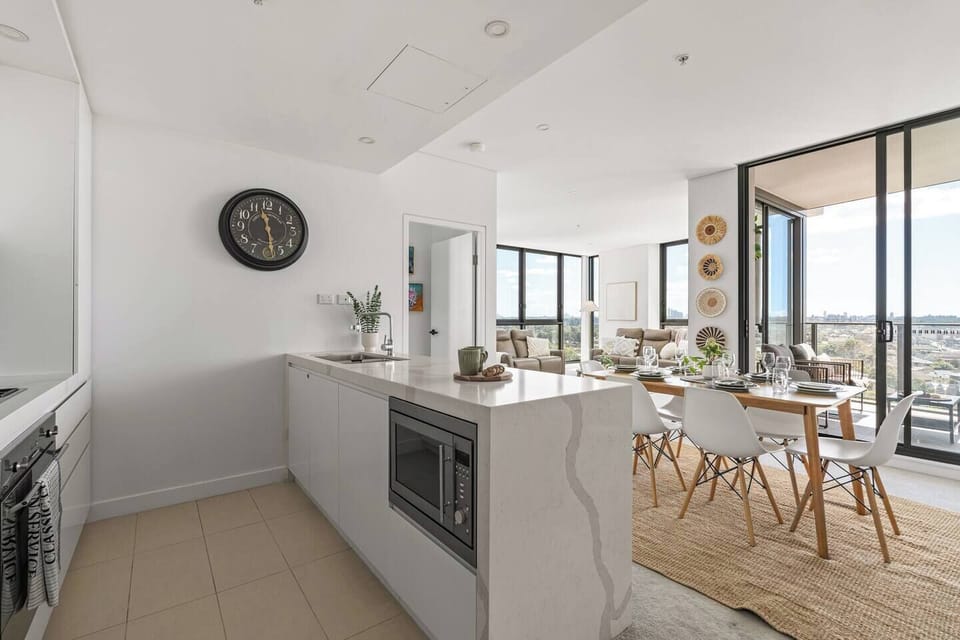 Cook, dine, and entertain in a spacious modern apartment designed for comfort, light, and connection.