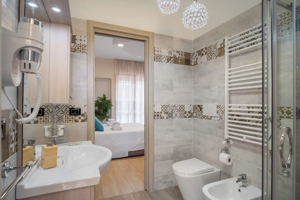 Basic Room, Balcony, Bay View (Ischia) | Bathroom | Slippers, bidet, soap, shampoo