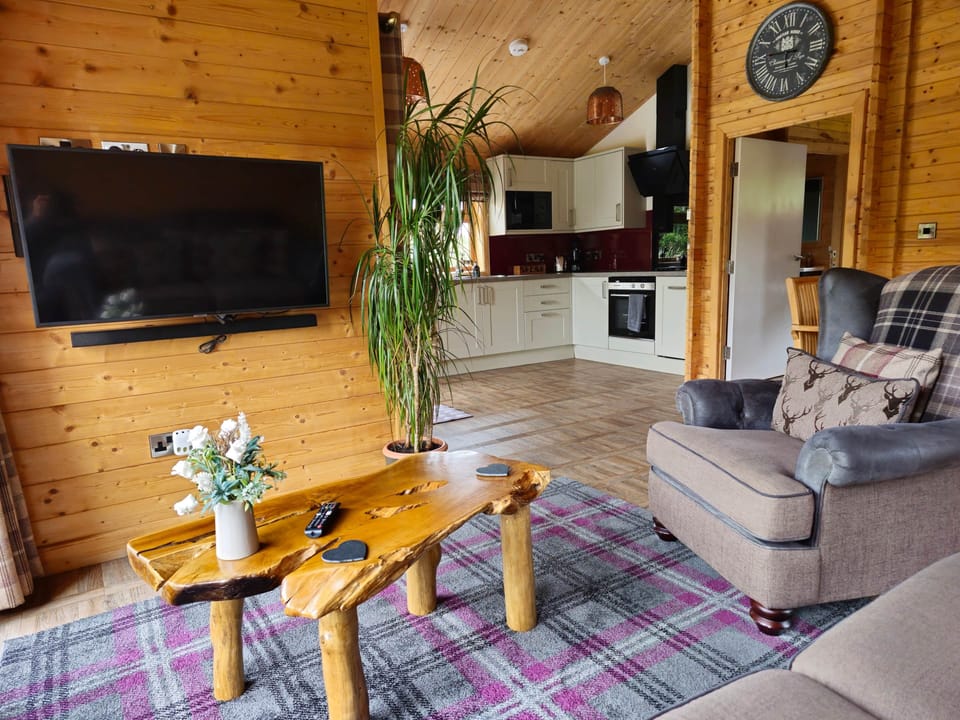 Open plan room with internet tv, sound bar & sub