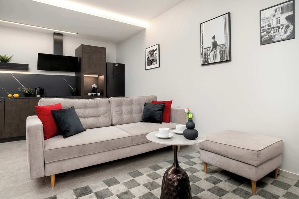 A bright perspective of the living area highlights the open floor plan and the consistent modern interior design.