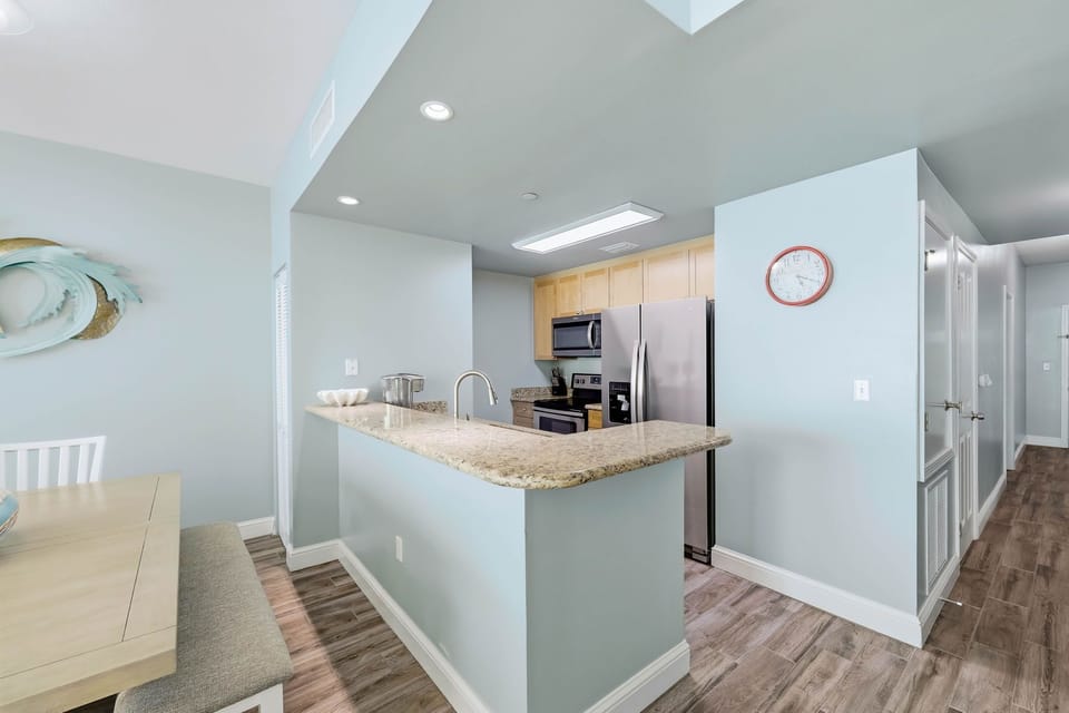 Modern kitchen with stainless steel appliances and granite countertops