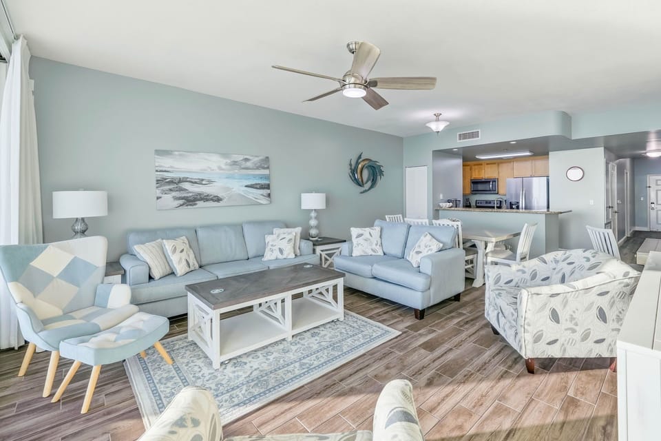 Spacious living room with coastal-inspired decor and comfortable seating.