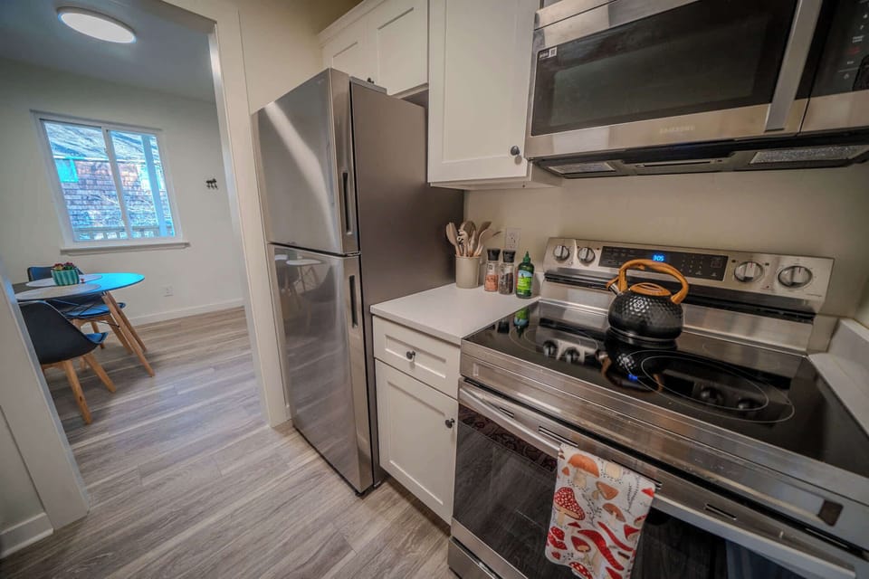 All-new stainless appliances in the well-equipped kitchen