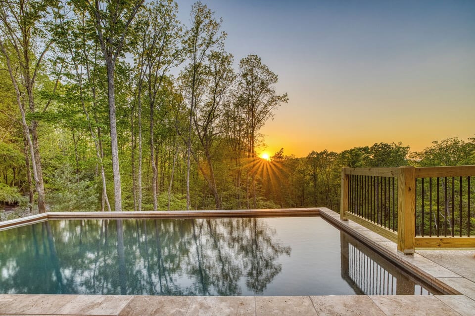 Enjoy unforgettable sunsets from Aska Splash's private heated pool. Surrounded by peaceful woods and mountain serenity, it's the perfect place to swim, relax, sip a drink, or unwind after a day exploring downtown Blue Ridge and the Aska Adventure Area.