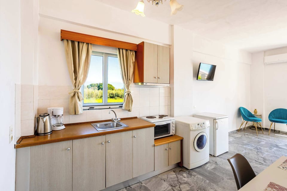 Fully Equipped Kitchen with Wooden Cabinets