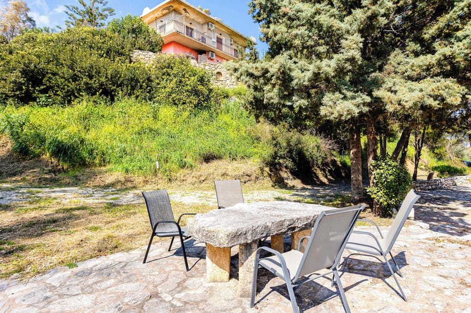 Garden Patio with Outdoor Seating and Green Surroundings